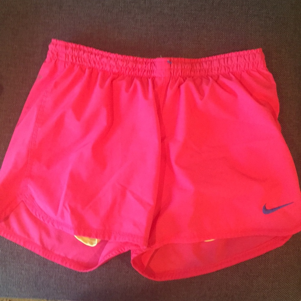 Pink and yellow Nike running shorts